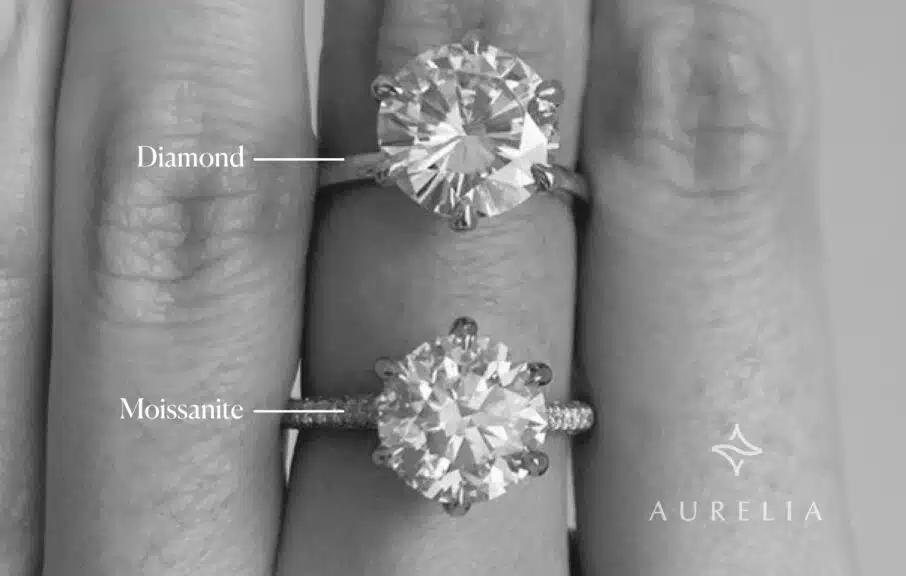 two engagement ring worn in a hands of a model. One of them is diamond and other one is Moissanite.