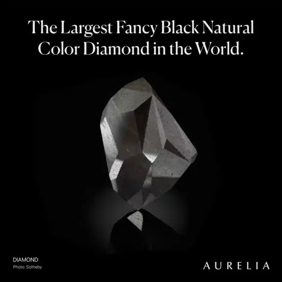 The black horse of the diamond world, the 555.55 ct Fancy black Enigma diamond is getting us ready for the Halloween season 🕷️👻 Why is the Enigma so rare, valuable and well…enigmatic? - In 2004, @Sothebysjewels named the Enigma diamond as the largest fancy black natural color diamond in the world. - It is a carbonado diamond, which is an unusual polycrystalline variety of diamond. It is made up of many small diamond grains in random orientation, a property that gives carbonado an extreme toughness that was historically valued for making tools. - The numerous crystals impede light refraction and increase absorption, thus giving the stone its black appearance.- The natural conditions that form carbonado remain unclear and several theories have been proposed. A perplexing observation is that carbonado is only ever found in sedimentary deposits at Earth’s surface. Unlike other mined diamonds, it has never been found in a kimberlite or related mantle-source magma. - Some scientists have speculated that carbonado has extraterrestrial origins and that the pieces we find fell from the sky as fragments of a meteorite. - It weighs 555.55 carats and has 55 facets. The number 5 is considered auspicious in Middle Eastern culture and is associated with the Hamsa palm symbol, which represents blessings, power and strength.