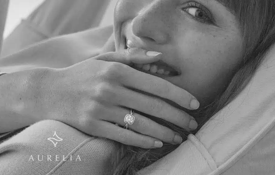 A women is laughing, showing happiness by wearing a lab grown diamond in her finger