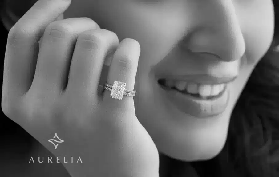 A women is laughing, showing happiness by wearing a lab grown diamond in her finger