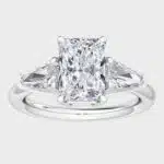 Shop 1 carat lab-grown radiant shield-cut three-stone engagement rings below $1000. D-E color, VS1-VS2 clarity, crafted in 14k white gold.