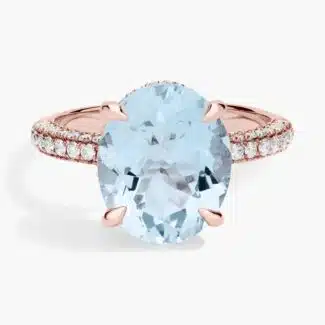 This Aquamarine as Engagement Ring from Blue Nile features a stunning oval aquamarine gemstone, accented with 94 diamonds, set in 14K rose gold.