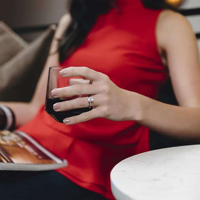 Elegant 2.52 cttw DEW emerald cut moissanite engagement ring by Charles & Colvard in 14k white gold. Lab-grown and warrantied