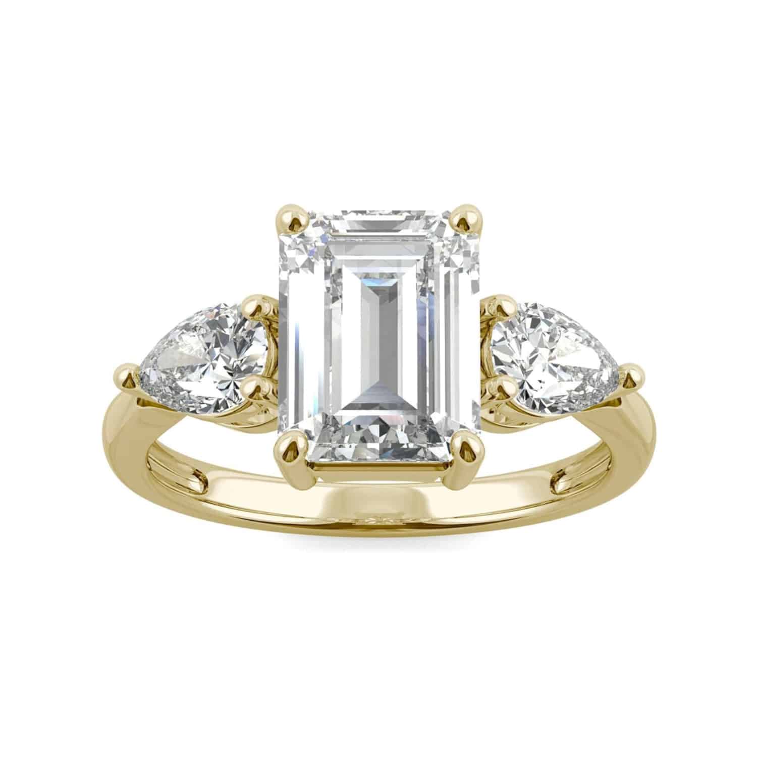 Elegant 3.38 cttw DEW emerald cut moissanite engagement ring by Charles & Colvard in 14k yellow gold. Lab-grown & warrantied.