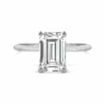 Elegant 2.52 cttw DEW emerald cut moissanite engagement ring by Charles & Colvard in 14k white gold. Lab-grown and warrantied
