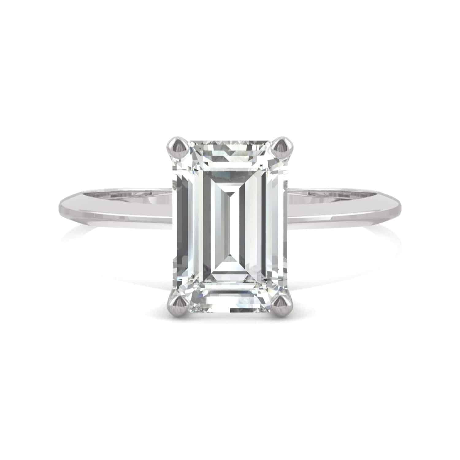 Elegant 2.52 cttw DEW emerald cut moissanite engagement ring by Charles & Colvard in 14k white gold. Lab-grown and warrantied