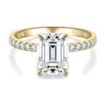 Elegant 3 carat emerald cut moissanite ring with side stones in 14K solid gold from CADYNO. Perfect for weddings & anniversaries.