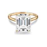 Stunning 5 carat emerald cut moissanite solitaire ring in natural 14k gold from ISAAC WOLF. Perfect for special occasions.