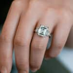 Kobelli 5.5 carat TGW emerald cut moissanite three-stone statement ring in 14k white gold. Shop this luxury engagement ring!