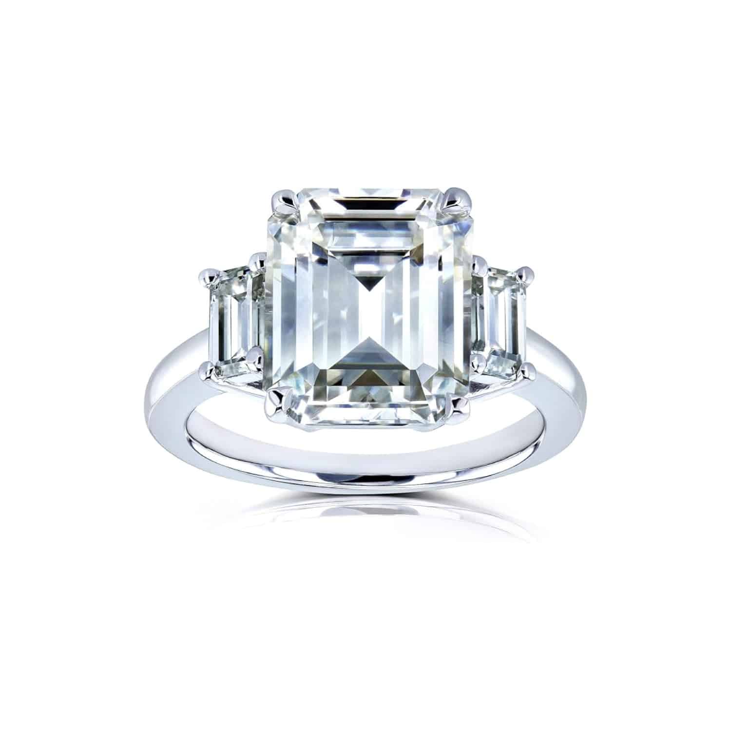 Kobelli 5.5 carat TGW emerald cut moissanite three-stone statement ring in 14k white gold. Shop this luxury engagement ring!