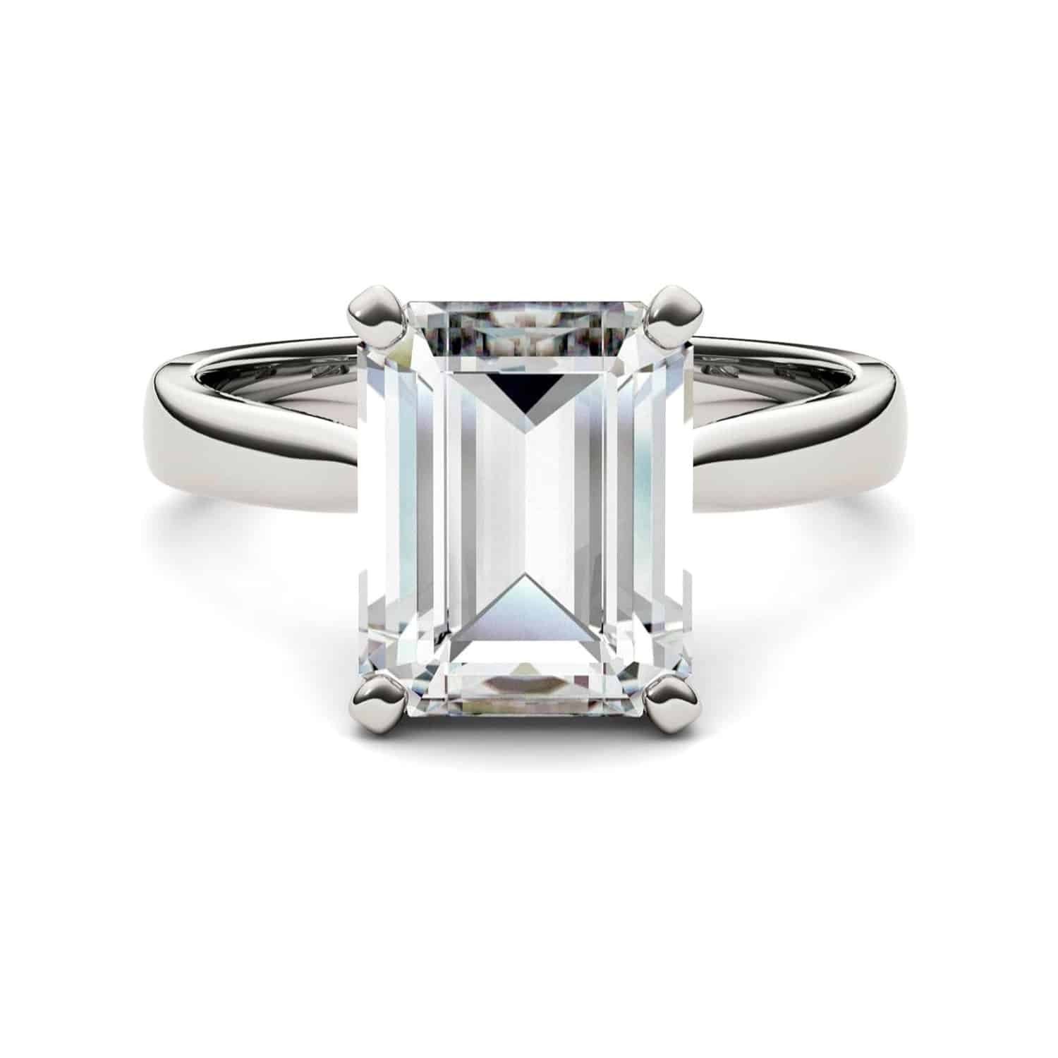 emerald-cut-moissanite-ring-666 Charles & Colvard emerald cut moissanite engagement ring in 14k white gold (3.55 cttw DEW). Lab-grown brilliance with a lifetime warranty.