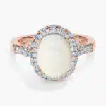 Oval Opal and Swiss Blue Topaz Halo Ring in 14k Rose Gold