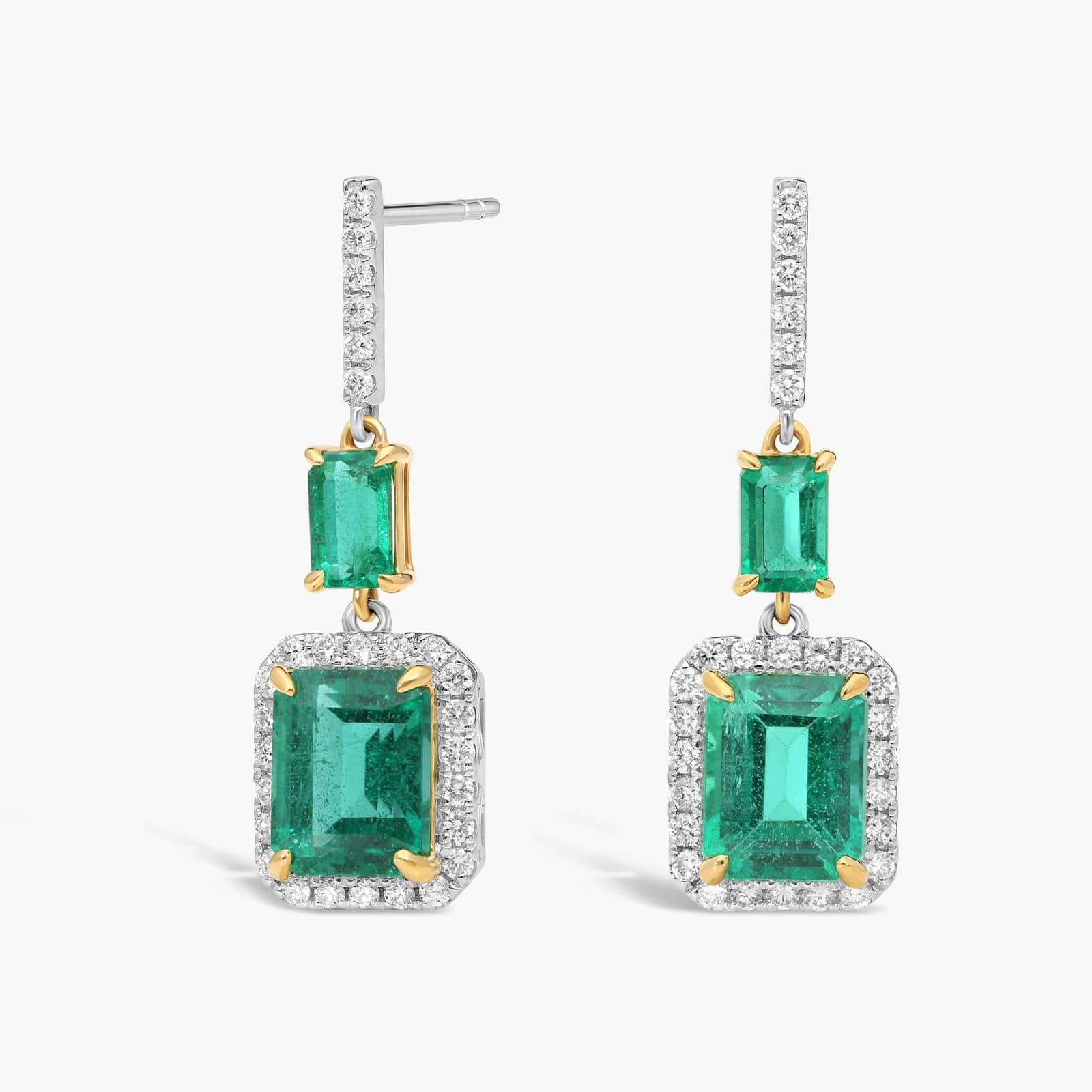 A stunning cascade of vibrant green emeralds and brilliant diamonds, expertly set in luxurious 18k yellow and white gold.