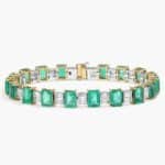 A breathtaking masterpiece featuring 19 vibrant green emeralds and over two carats of brilliant baguette diamonds set in polished 18k white gold.