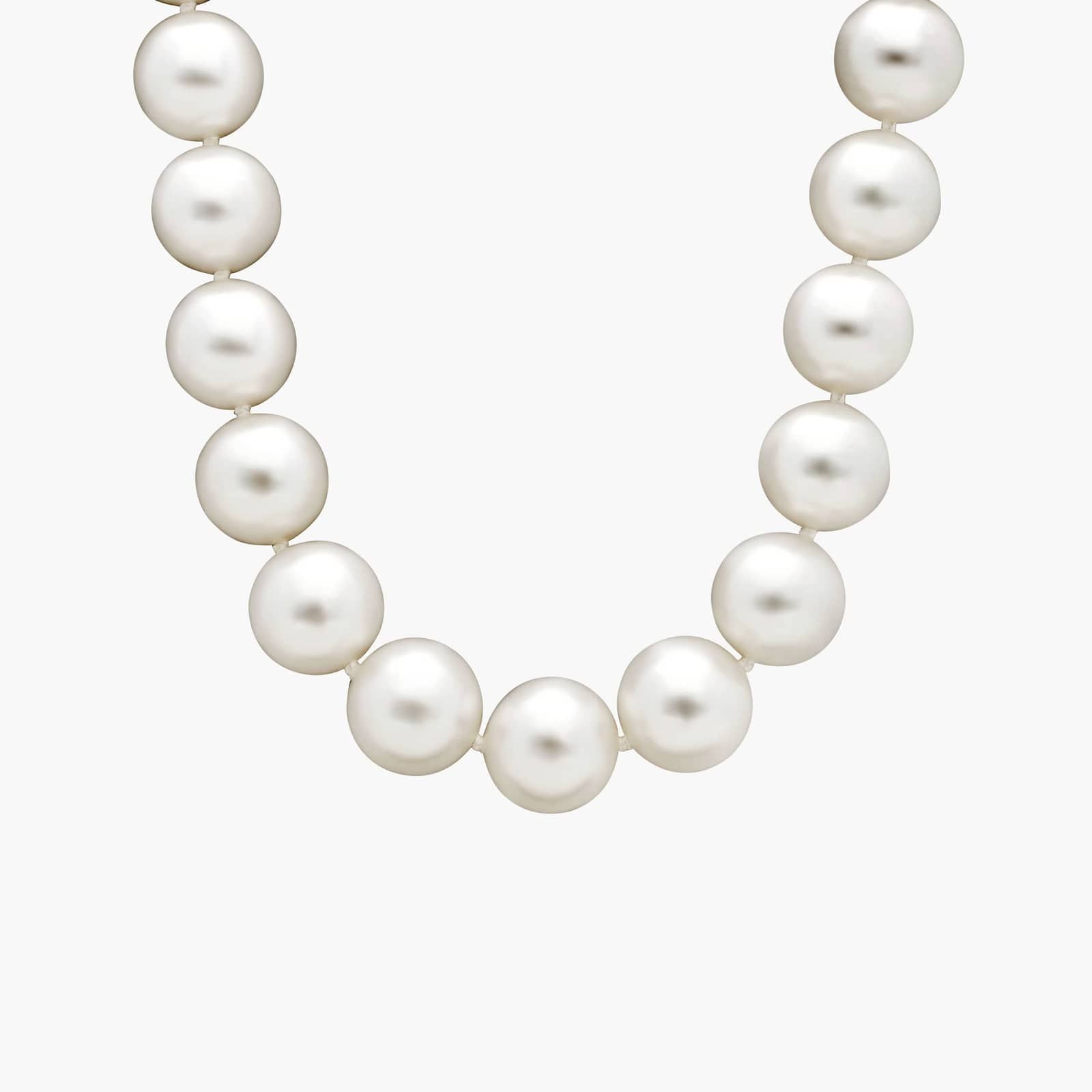 An exquisite 17-inch strand of exceptionally large and luminous South Sea cultured pearls, hand-knotted and secured with an 18k white gold safety clasp.