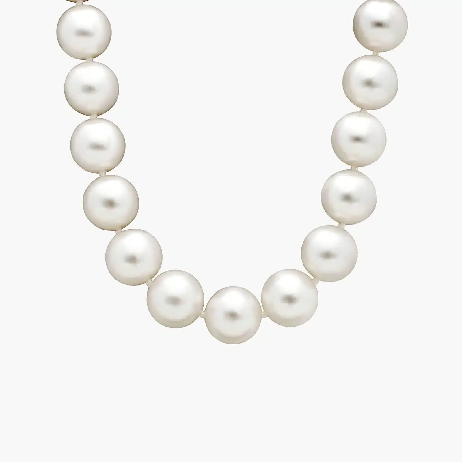An exquisite 17-inch strand of exceptionally large and luminous South Sea cultured pearls, hand-knotted and secured with an 18k white gold safety clasp.