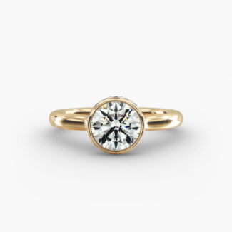 The Pavé Crown Bezel Solitaire hidden halo engagement ring in 14k yellow gold.
