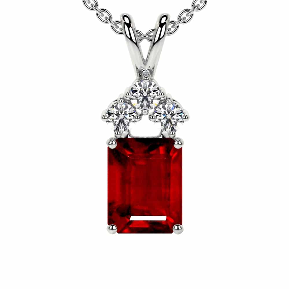Regal Ruby & Trio Diamond Pendant An exceptional AAAA heirloom-quality emerald-cut ruby, crowned by a trio of brilliant G-color diamonds and set in your choice of fine metal.