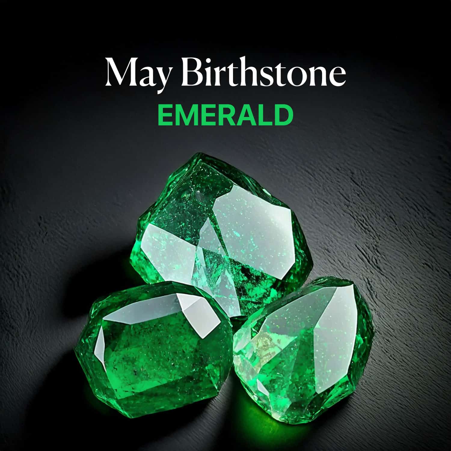 Three rough, unpolished Emerald gemstones, displaying deep green color and natural facets, with text 'May Birthstone EMERALD' overlayed, clearly identifying the May birthstone.