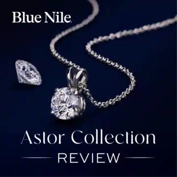 A Blue Nile diamond solitaire pendant from the Astor Collection, next to a loose round diamond. Text overlay reads "Astor Collection REVIEW".