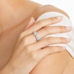 A model wearing the 0.80 ctw crossover diamond statement ring on her index finger, showing how its wide, multi-band design looks on the hand.