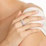 A model wearing the 0.80 ctw crossover diamond statement ring on her index finger, showing how its wide, multi-band design looks on the hand.