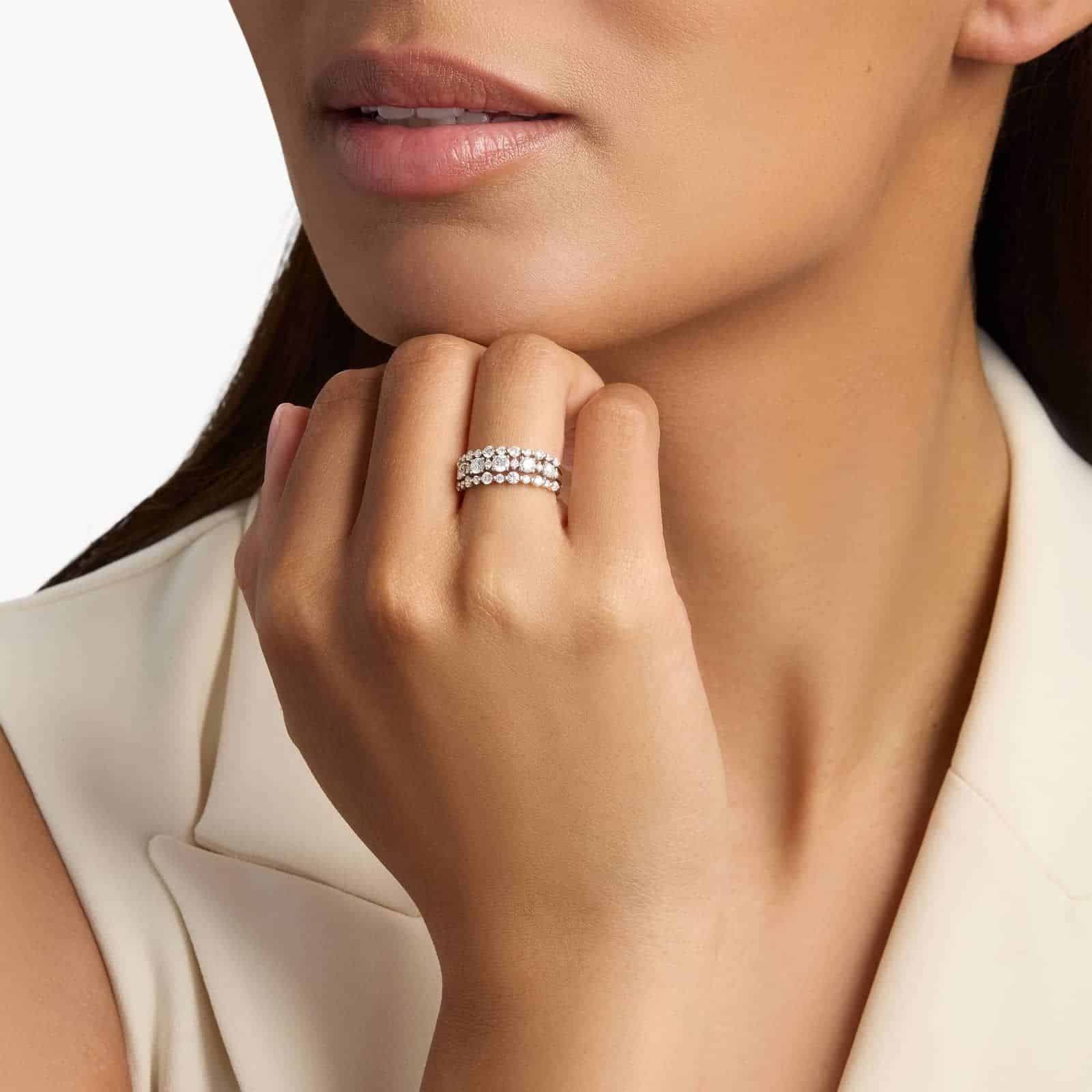 A model's hand wearing the brilliant 1-carat three-row diamond ring, showcasing its substantial width and sparkle as a right-hand statement piece.