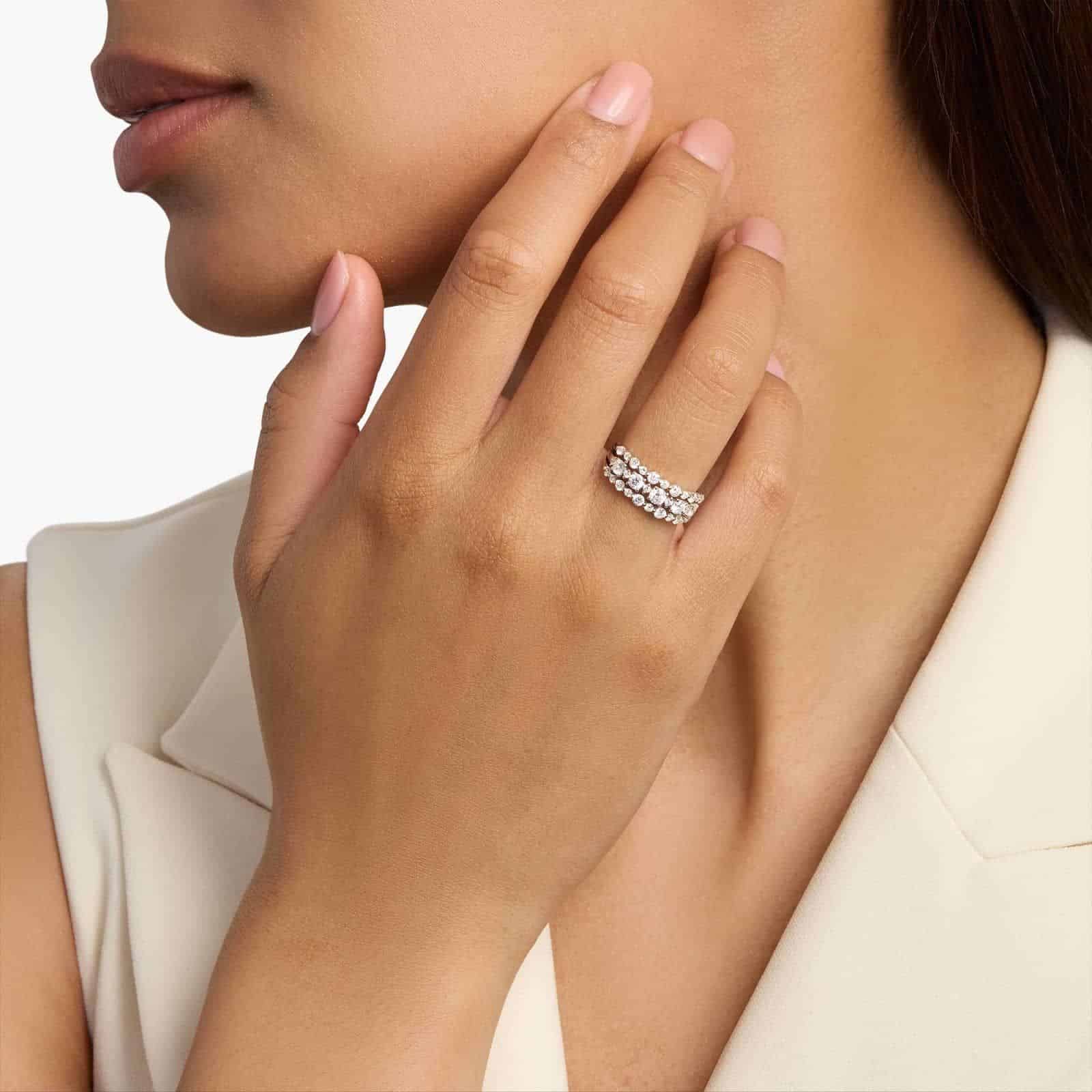 A model's hand wearing the brilliant 1-carat three-row diamond ring, showcasing its substantial width and sparkle as a right-hand statement piece.