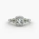 A high-resolution studio image of a GIA 1.50 carat cushion modified diamond engagement ring on a white background, highlighting the Ideal Cut and the intricate details of the halo and pavé setting.