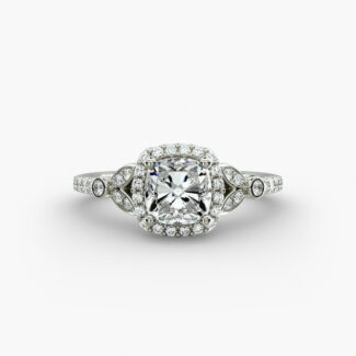 A high-resolution studio image of a GIA 1.50 carat cushion modified diamond engagement ring on a white background, highlighting the Ideal Cut and the intricate details of the halo and pavé setting.