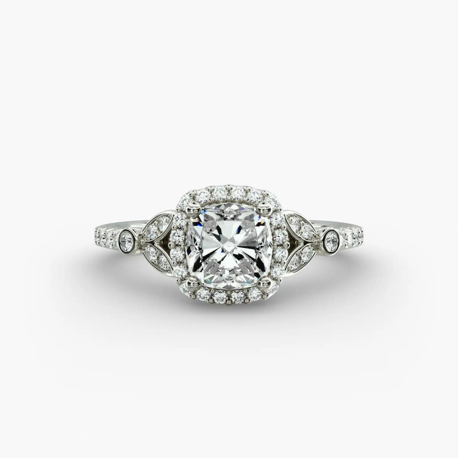 A high-resolution studio image of a GIA 1.50 carat cushion modified diamond engagement ring on a white background, highlighting the Ideal Cut and the intricate details of the halo and pavé setting.