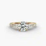 A professional studio image of a GIA 2.01 carat round diamond engagement ring on a white background, highlighting the Excellent Cut of the center stone and the intricate details of the lace bridge and pavé setting.