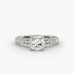 Close-up of a GIA 5.00 carat cushion modified diamond engagement ring on a white background, showcasing the intricate French pavé setting and the brilliant platinum craftsmanship.