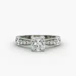 Close-up, high-magnification image of the GIA 5.02 carat E-FL cushion modified diamond ring on a white background, showcasing the "Ideal Cut" and flawless clarity of the center stone.