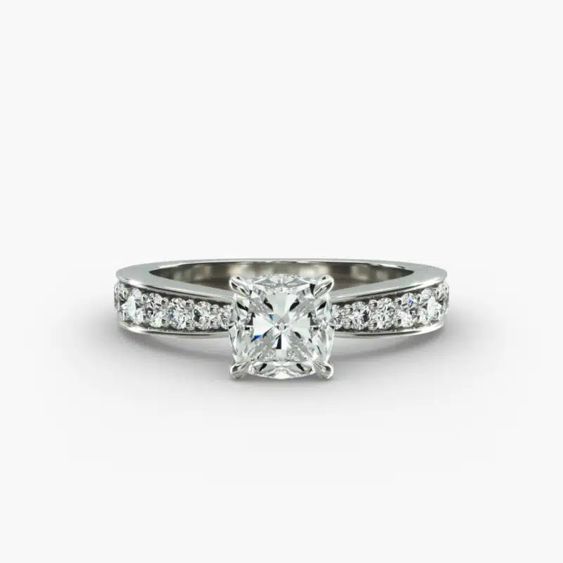 Close-up, high-magnification image of the GIA 5.02 carat E-FL cushion modified diamond ring on a white background, showcasing the "Ideal Cut" and flawless clarity of the center stone.