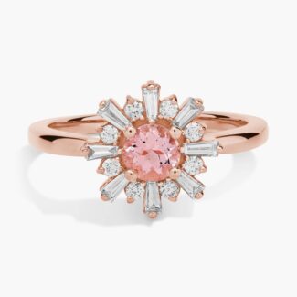 A close-up studio shot of a **morganite and baguette diamond halo ring** on a white background, highlighting the contrast between the round center stone and the linear baguette-cut diamonds.