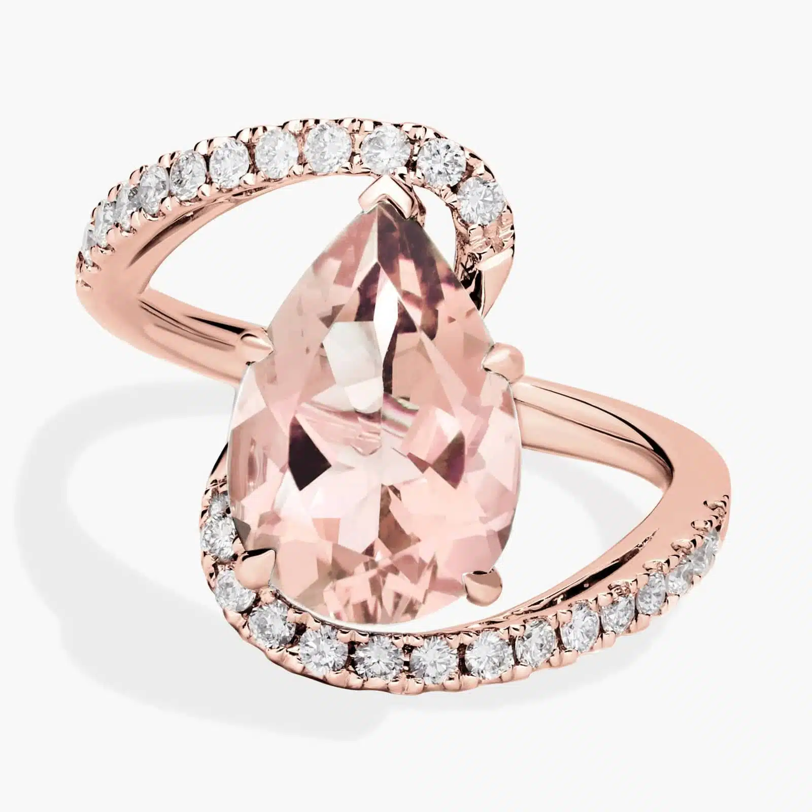 Pear Shaped Morganite and Diamond Twist Band in 14k Rose Gold A close-up studio shot of a **pear-shaped morganite and diamond twist band ring** on a white background, highlighting the graceful shape of the center stone and the intricate pavé detail on the band.