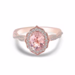 Modified Sakura Cut Moissanite Engagement Ring in solid gold with oval cut Sakura Pink and round DEF VVS moissanites.