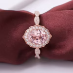 Modified Sakura Cut Moissanite Engagement Ring in solid gold with oval cut Sakura Pink and round DEF VVS moissanites.