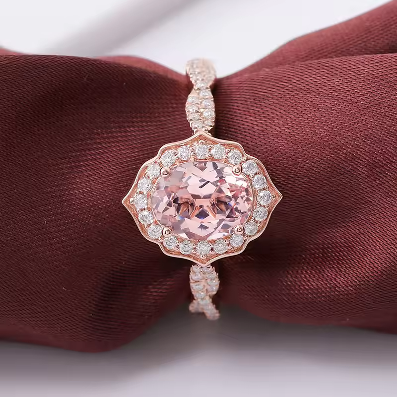 Modified Sakura Cut Moissanite Engagement Ring in solid gold with oval cut Sakura Pink and round DEF VVS moissanites.