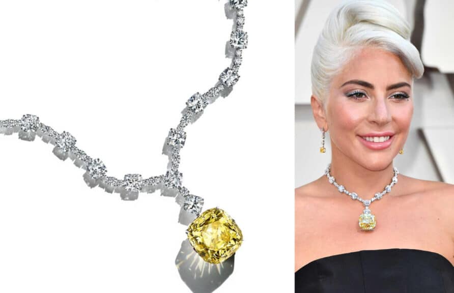 A side-by-side image. On the left is a product photo of the Tiffany Yellow Diamond, a large, magnificent cushion-cut yellow diamond pendant, set on a chain of brilliant white diamonds. On the right, Lady Gaga is shown wearing the same iconic necklace at the Academy Awards, complementing her black dress and platinum-blonde hair.