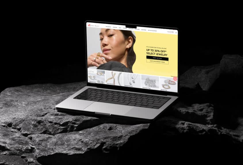 A laptop displaying the James Allen homepage, highlighting their user-friendly experience and selection as one of the best places to buy engagement rings online.