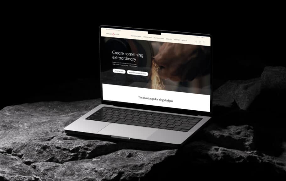 A laptop displaying the Taylor & Hart homepage, which invites users to "Create something extraordinary," highlighting their focus on custom design and making them one of the best places to buy engagement rings for a bespoke experience.