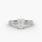 A close-up studio shot of a 3ct radiant cut diamond ring, highlighting the G-VVS2 clarity of the center stone and the intricate pavé setting.