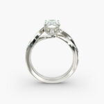 A close-up side view of a 3.5 carat radiant cut diamond ring, showcasing the narrow 1.80mm platinum band and the subtle Twist Solitaire Plus details.