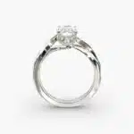 A close-up side view of a 3.5 carat radiant cut diamond ring, showcasing the narrow 1.80mm platinum band and the subtle Twist Solitaire Plus details.