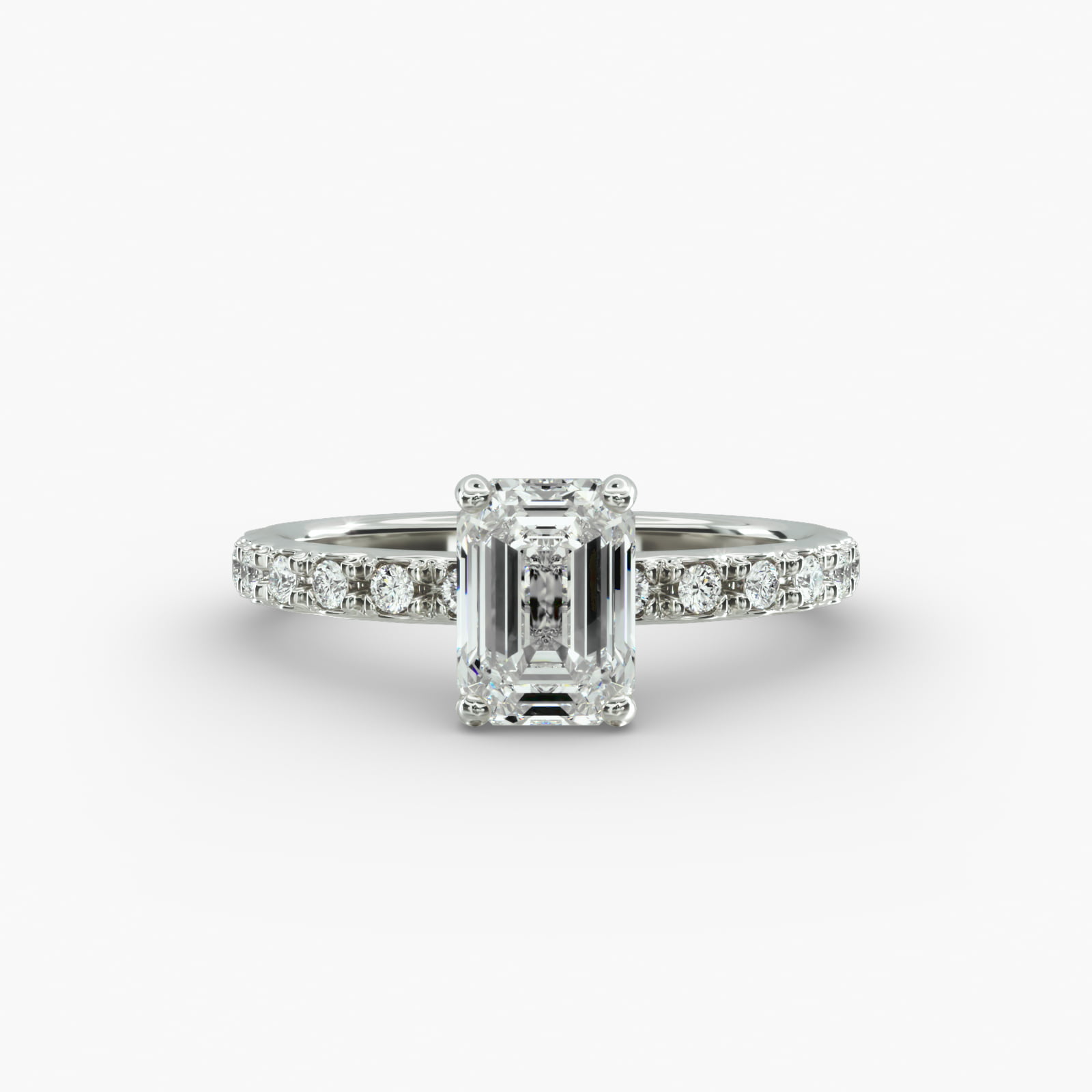 A close-up studio shot of a **7 carat diamond ring**, highlighting the stunning clarity of the emerald cut diamond and the delicate detail of the French pavé side stones.