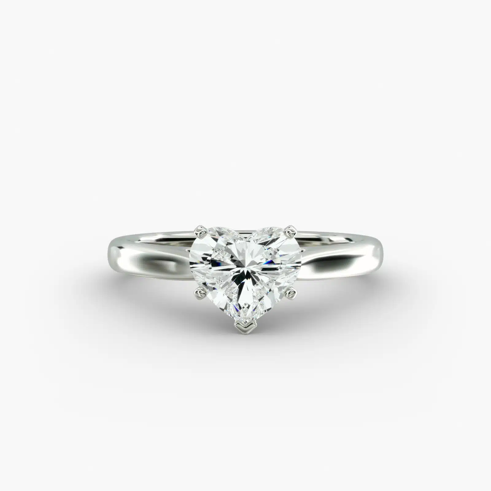 A close-up studio shot of a **7 carat diamond ring**, highlighting the stunning D-VS2 heart diamond and the elegant tapered cathedral setting in platinum.