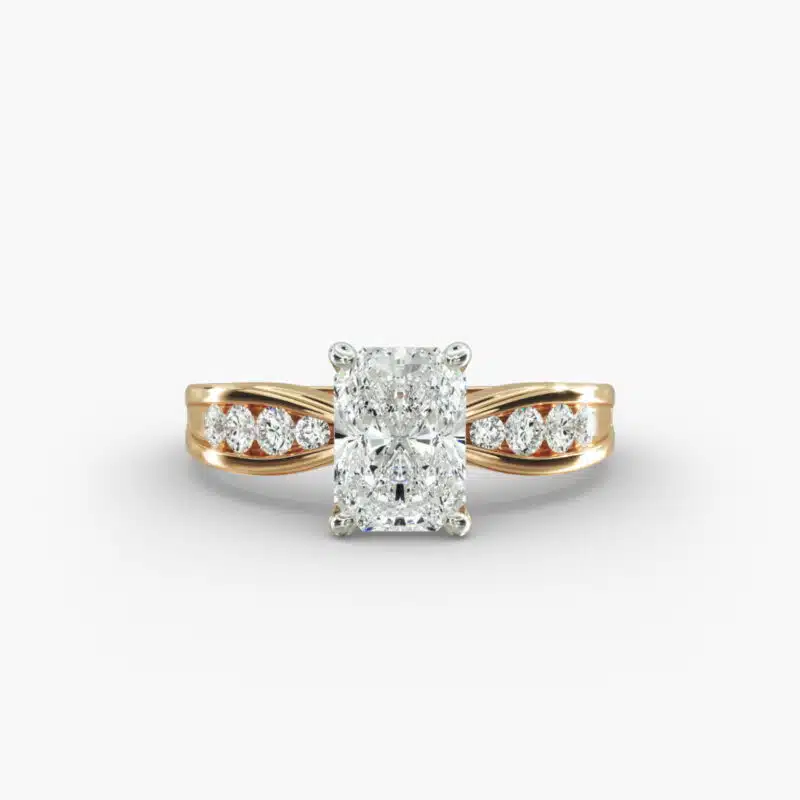 A close-up view of a 2.5 carat radiant cut diamond ring in 14k yellow gold, highlighting the channel-set diamonds.