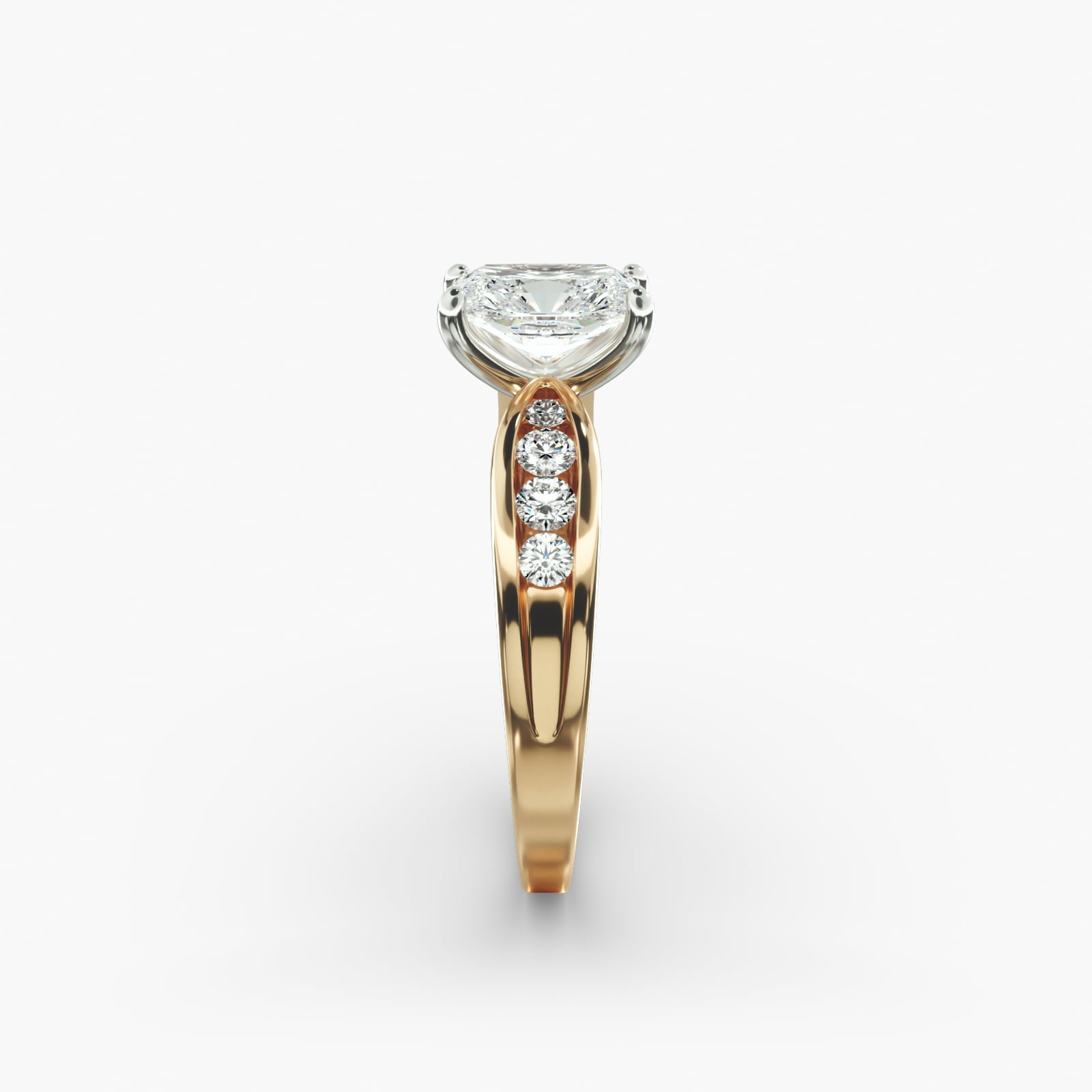 A close-up side view of a 2.5 carat radiant cut diamond ring in 14k yellow gold, highlighting the channel-set diamonds.